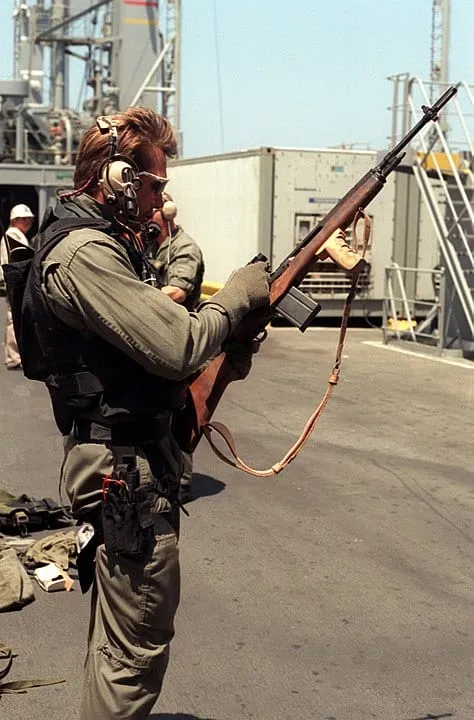A SEAL operator with an M14 rifle participating in maritime interdiction enforcement during Operation Desert Storm.