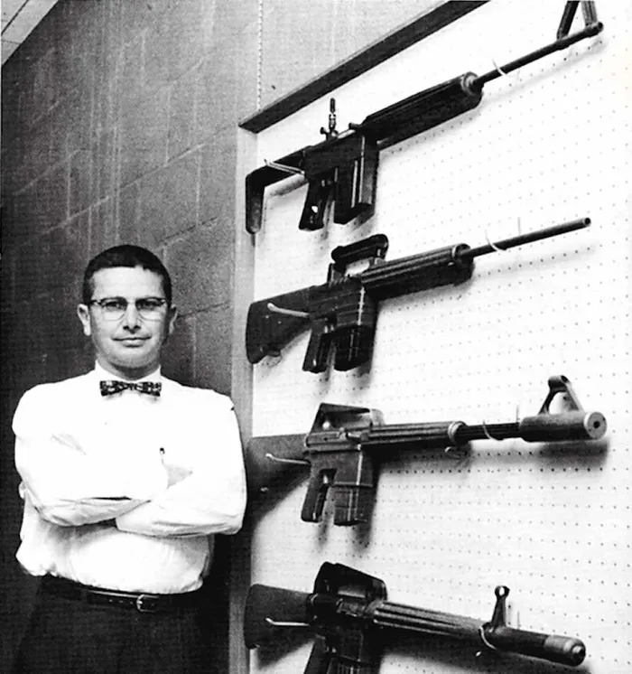 Eugene Stoner with his early M16 prototypes