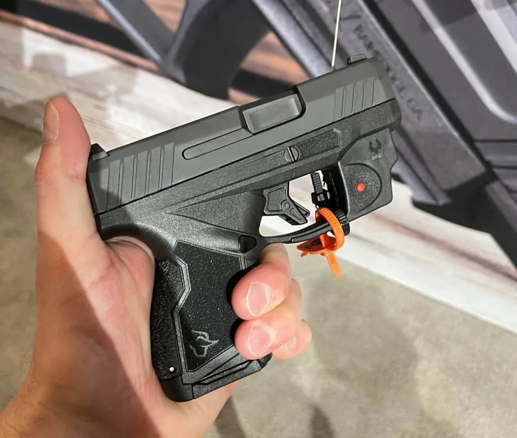 holding taurus gx4 in hand