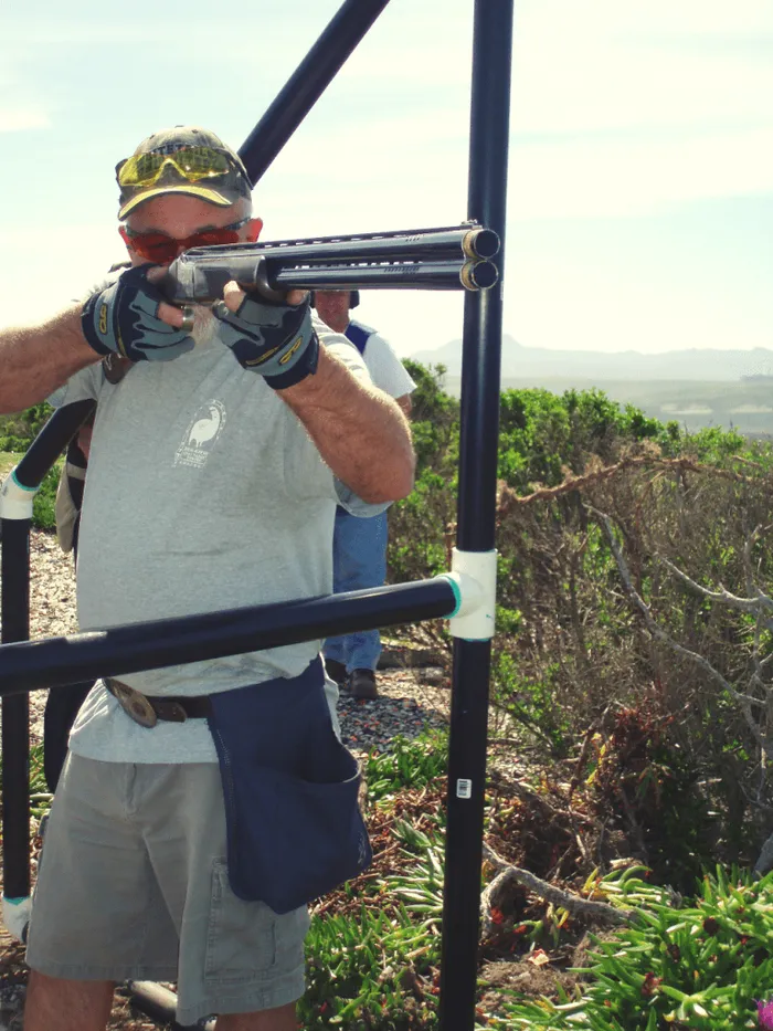 man shooting sporting clays