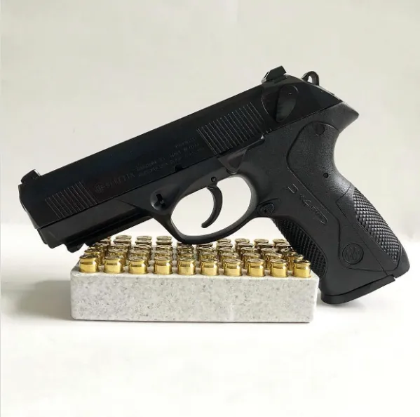Beretta PX4 Storm Full size leaning against ammo