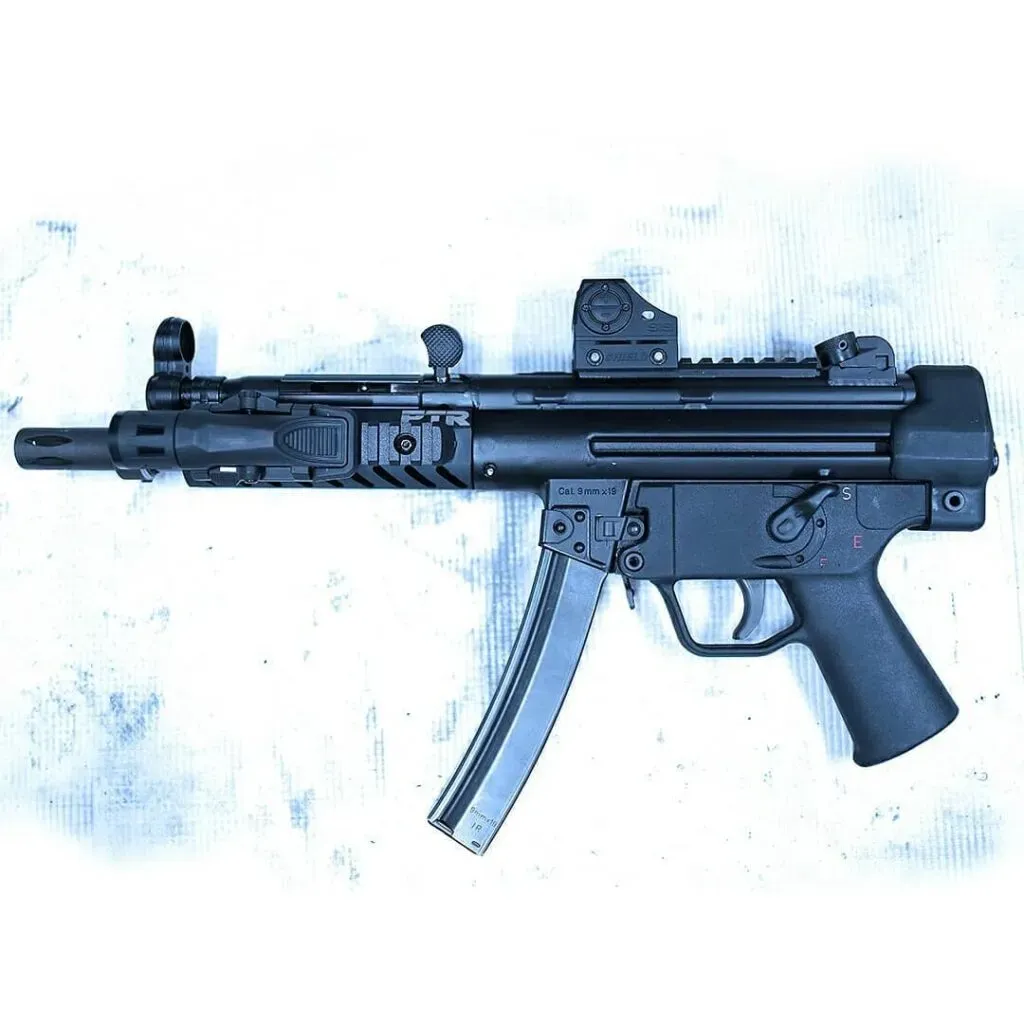 PTR 9C 9mm pistol with HK 3-lug flash hider, Inforce light, and Shield red dot optic.