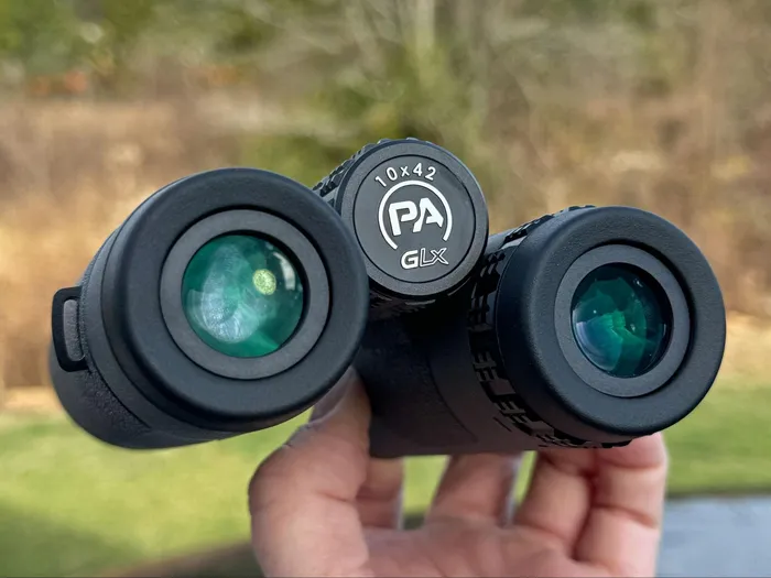 GLx binocular lens with a fingerprint, demonstrating clear visibility despite smudges
