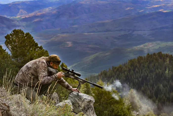 The Springfield Armory Model 2020 Redline rifle being tested in its ideal environment, rugged outdoor terrain