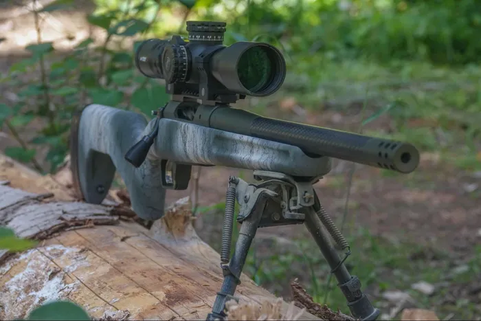 The Springfield Armory Model 2020 Redline rifle equipped with a Harris bipod for stable shooting